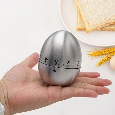 Montrer minuterie forme oeuf main